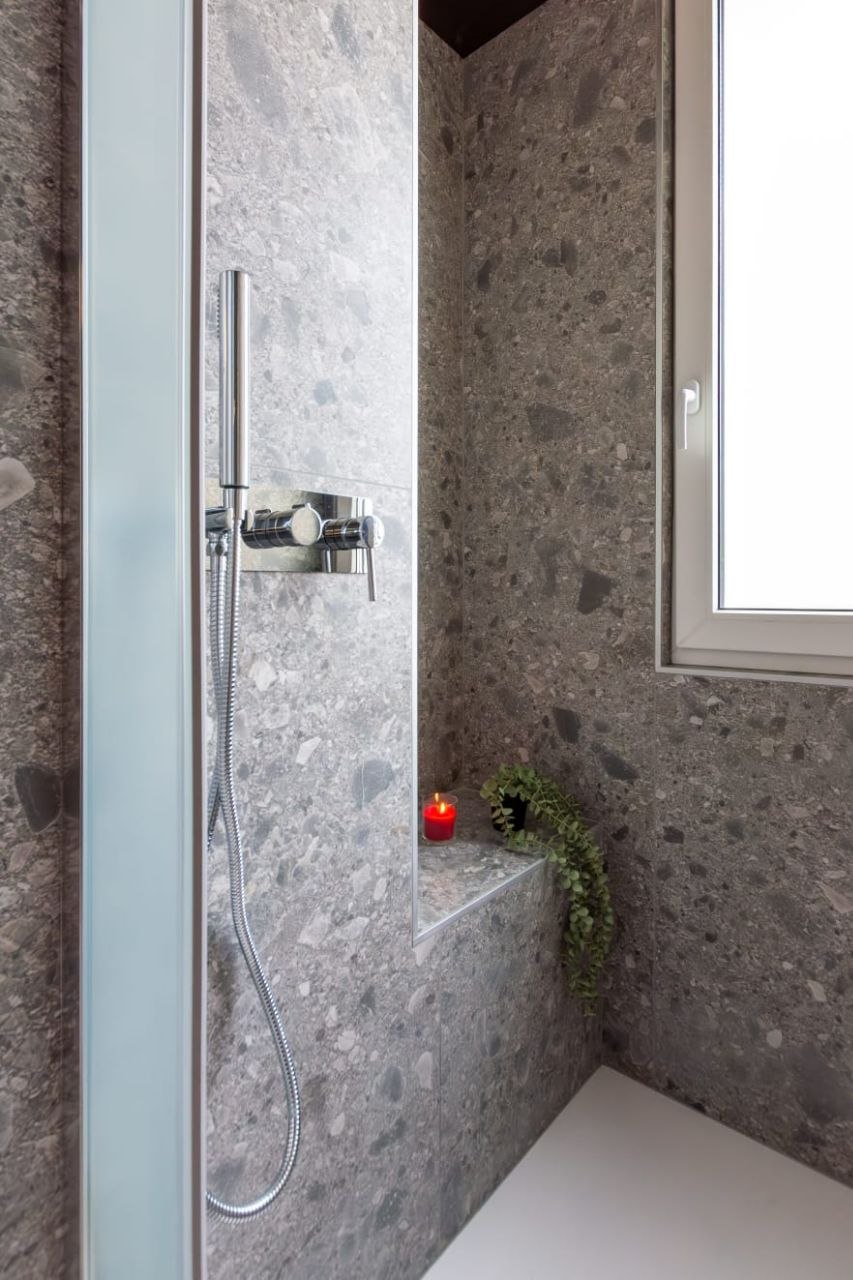 Walk-in shower with seat and candle