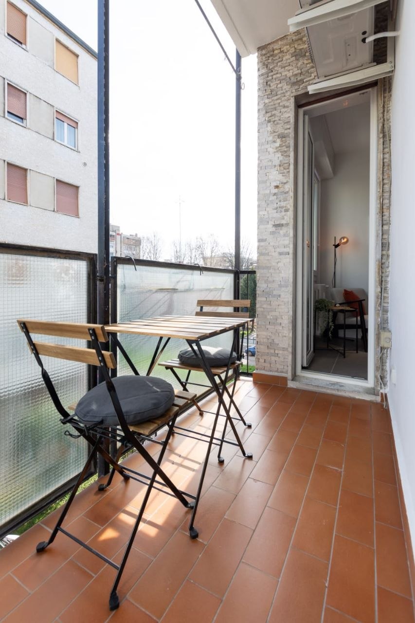Balcony with table and chairs